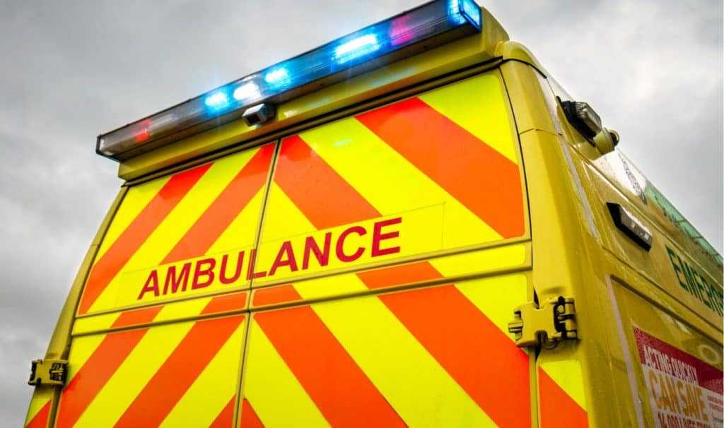 NHS Ambulance with Blue Flashing Lights | Safe Medical Transport